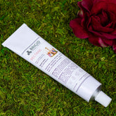 beltane hand lotion rose jasmine clary sage and frankincense hand made natural shea butter for dry hands winter skin older skin autumn necessities celtic inspired made in kitsap county washington state image shows hand lotion tube on a moss background with a red flower